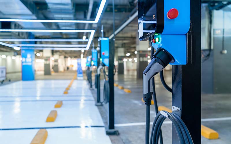 Electric car charging station in parking lot