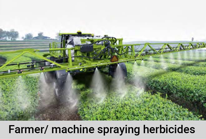 Farmer/ machine spraying herbicides